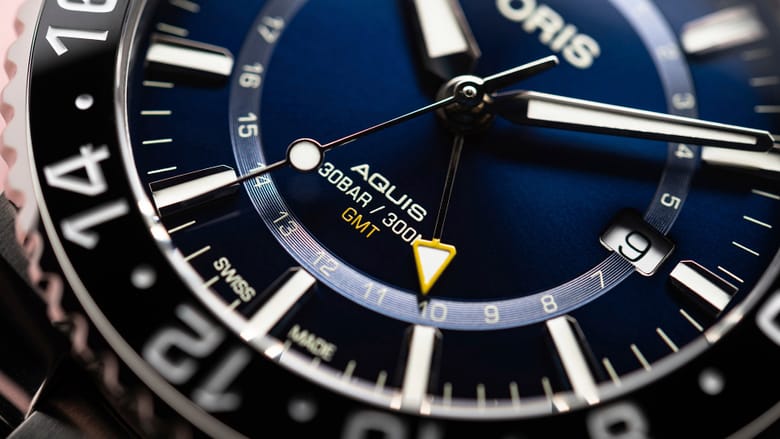 01 798 7754 4135-07 8 24 05PEB - Aquis GMT Date